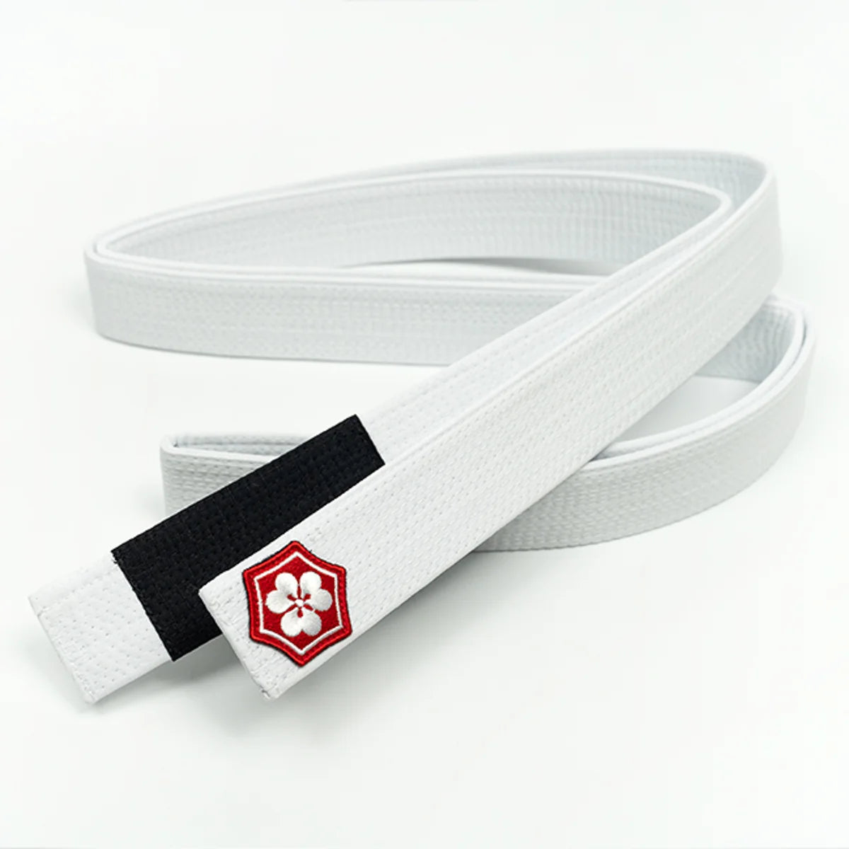 White KANJI AIR BJJ belt with a black rank bar