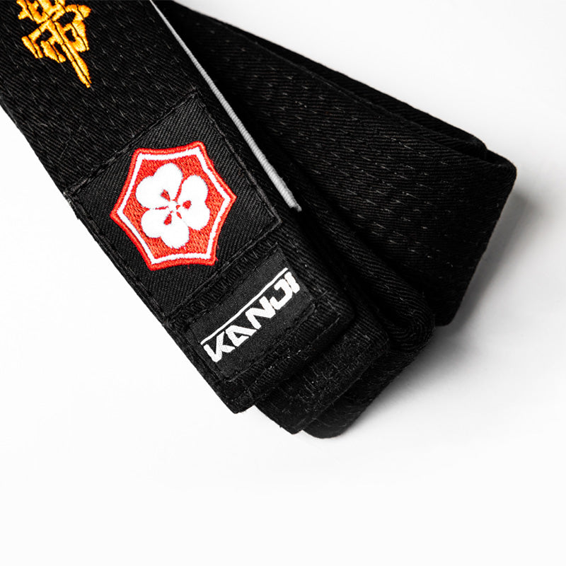 A WHITE BELT WHO NEVER QUIT EDITION — ORIGINAL orange embroidery close-up