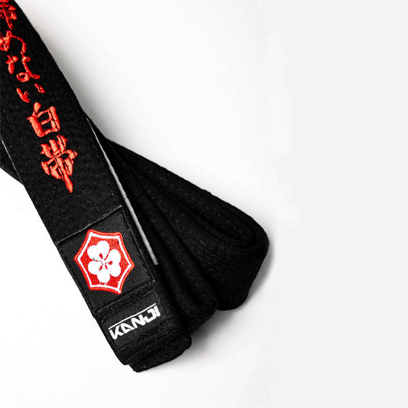 A WHITE BELT WHO NEVER QUIT EDITION — ORIGINAL red embroidery close-up